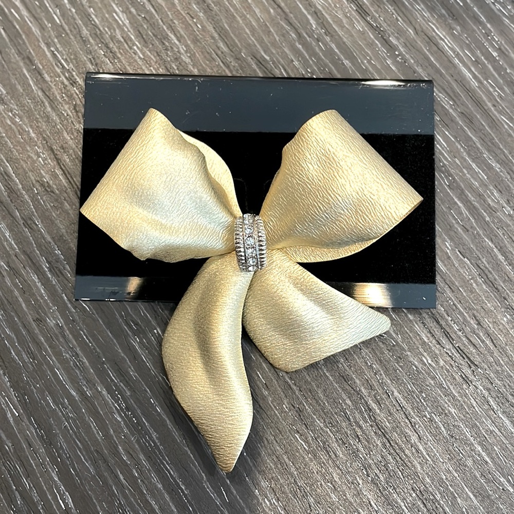 Golden bow with rhinestones